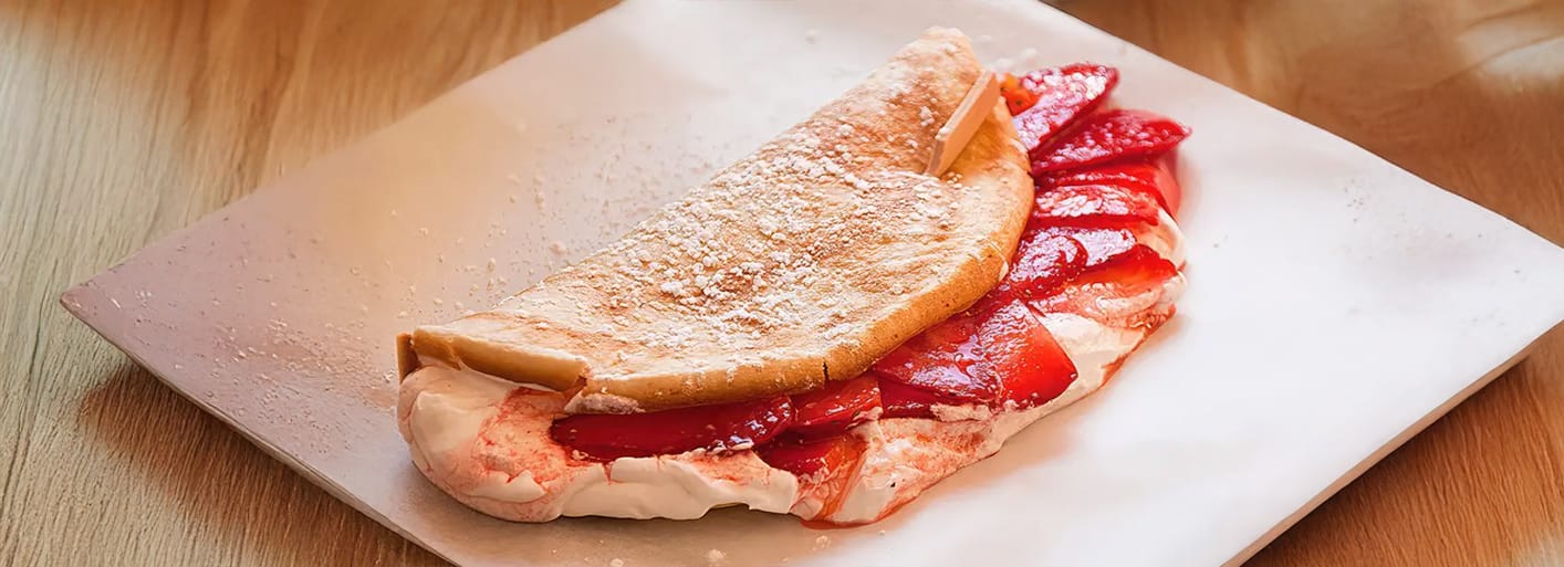 Sweet strawberry omelet – a light and fluffy omelet filled with fresh strawberries for a fruity dessert.