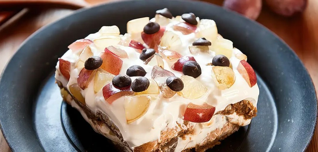 Sweet grape tiramisu topped with fresh grapes and cream – a fruity twist on the classic Italian dessert