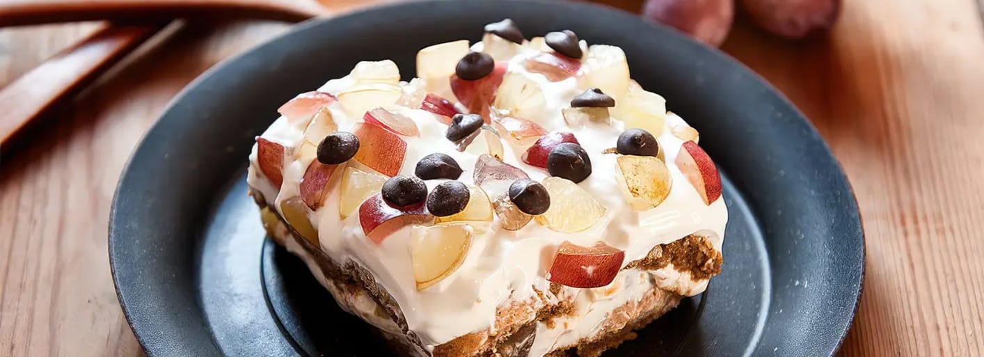 Sweet grape tiramisu topped with fresh grapes and cream – a fruity twist on the classic Italian dessert
