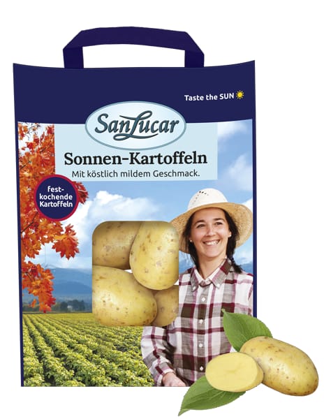 A 1.5kg package of SanLucar Sonnen-Kartoffeln, featuring a smiling woman in a hat with the label "Firm boiling potatoes with a delicious mild taste."