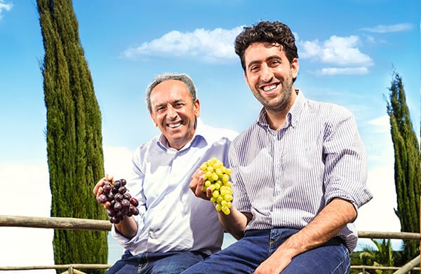 Giuliano, a SanLucar farmer, smiling in the fields, representing dedication to sustainable agriculture and fresh produce.