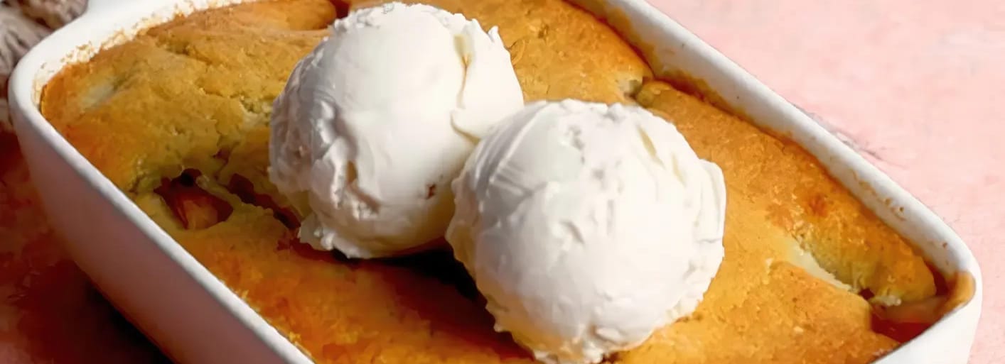 Peach cake with vanilla ice cream – a delicious dessert with fresh peaches, flaky crust, and creamy ice cream.