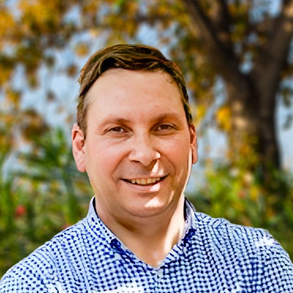 Manuel José, a SanLucar farmer, standing in the fields and showcasing dedication to sustainable agriculture and fresh produce.