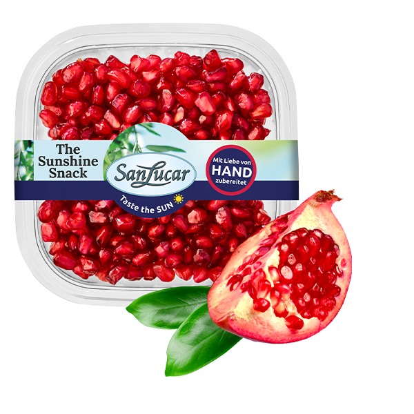 Fresh_Cut_pomgranate_76835 Freshly cut pomegranate with juicy red seeds, isolated on a white background – antioxidant-rich and vibrant fruit.