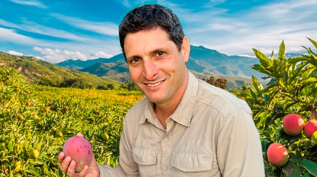 Satori, a SanLucar farmer, standing in the fields and showcasing dedication to sustainable agriculture and fresh produce.