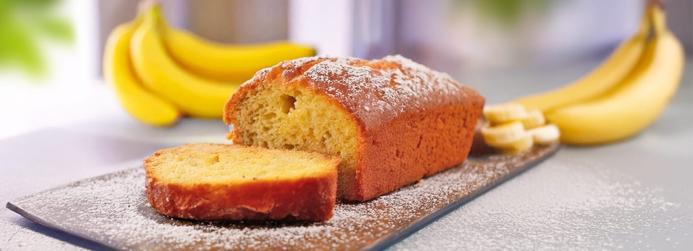 Banana Bread_header Freshly baked banana bread with a golden crust – a moist and delicious homemade treat