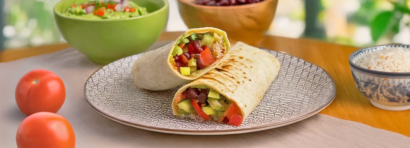 Veggie Burrito – tortilla filled with fresh vegetables, black beans, rice, and avocado salsa.