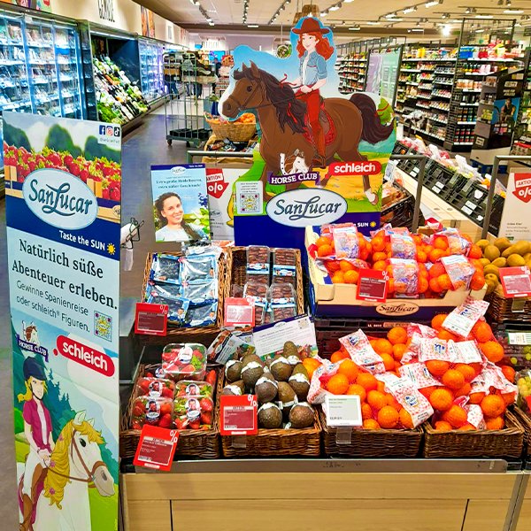 BlogPOSt-Schleich SanLucar fruit display, Schleich Horses Club, fresh fruit promotion, buy fresh pineapple, premium strawberries, best kiwis, exotic fruit shopping, sustainable farming, healthy snacks for kids, fun shopping experience.